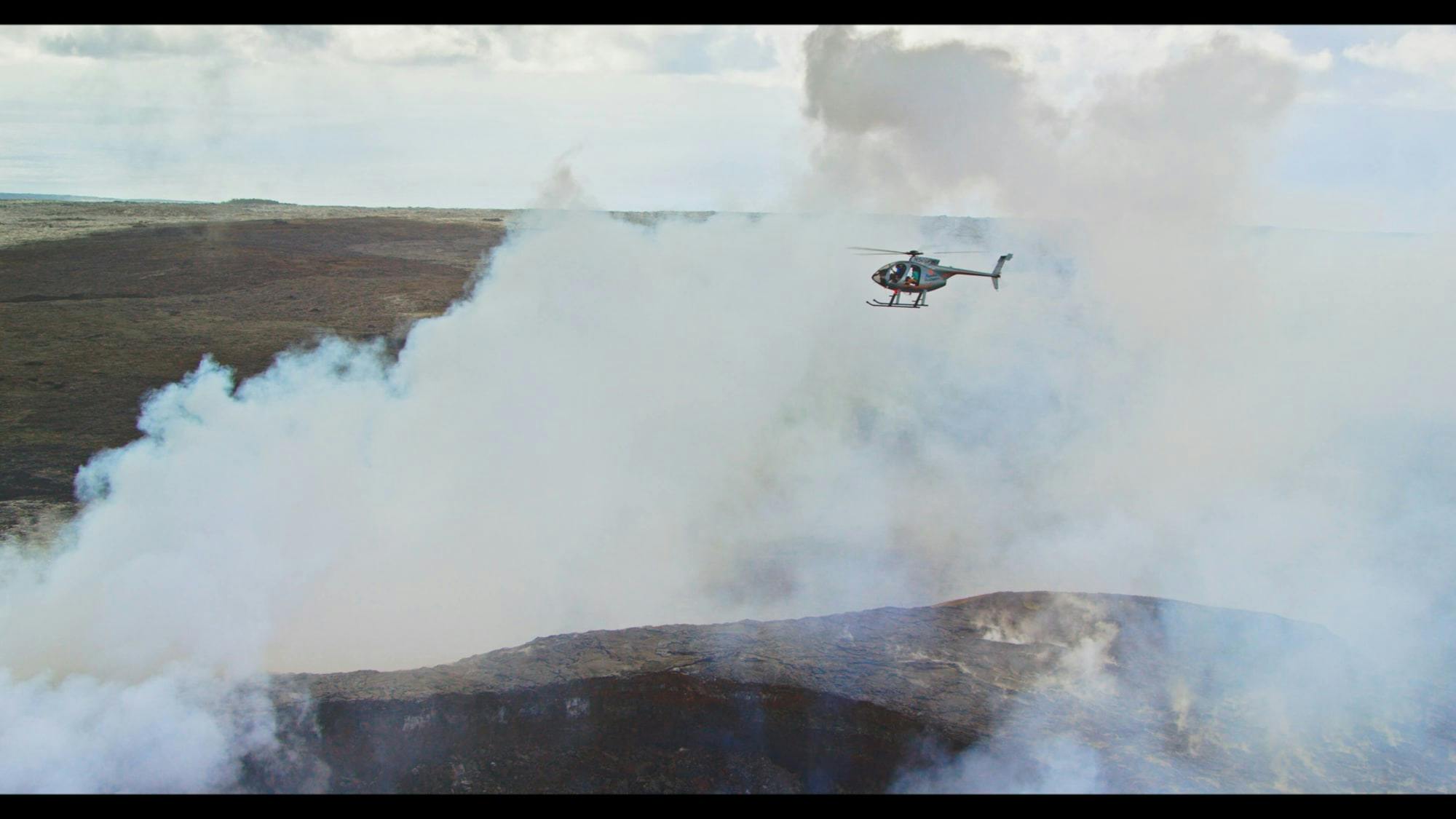 helicopter in smoke from lava