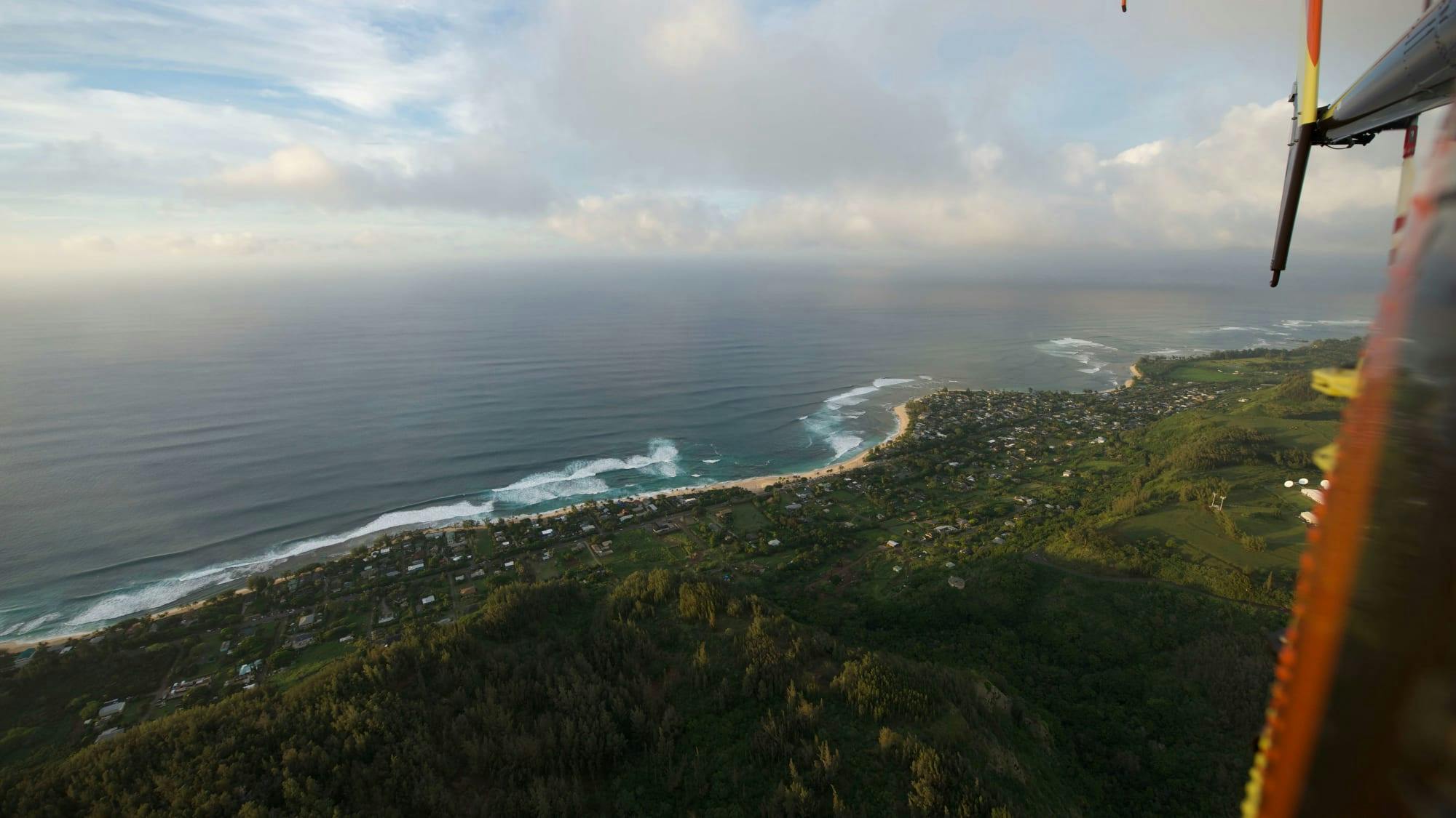 Aerial view of Hawaiian beach front from the Magnum helicopter 