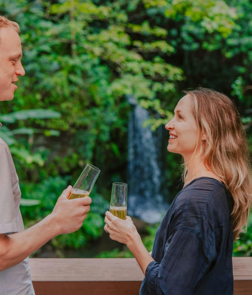 couple drinking champagne in nature